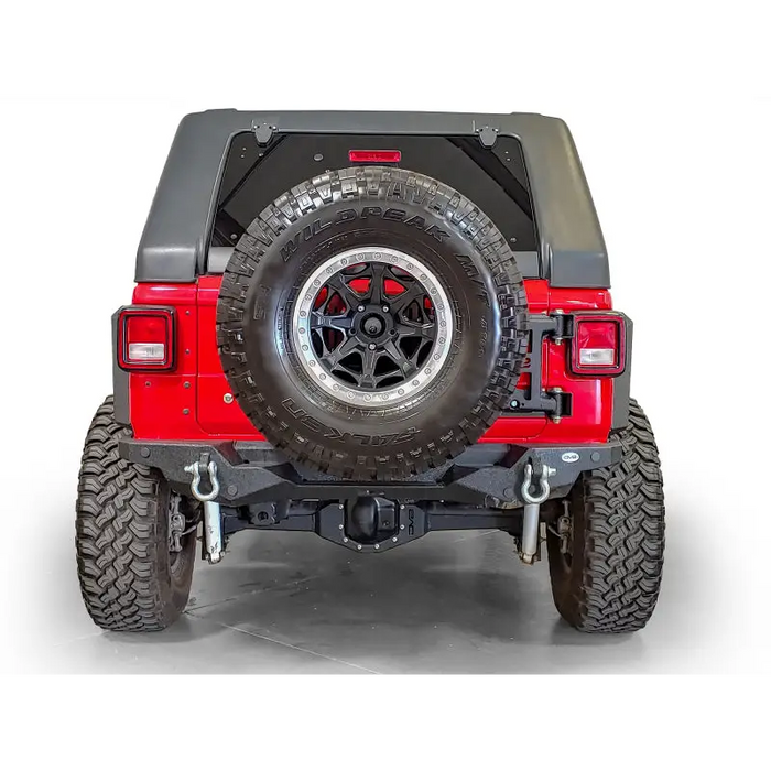 DV8 Offroad Tire Carrier with OEM Style Access and Tire Cover on Jeep Wrangler