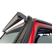 Car with roof rack featuring a road rail mount.