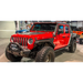 DV8 Offroad 2019+ Jeep Gladiator Armor Fenders with red jeep parked in garage and blue truck