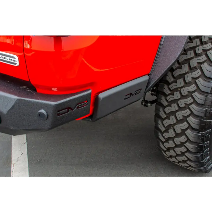 Red Jeep with Black Bumper and Tire in DV8 Offroad 2019+ Jeep Gladiator Bedside Sliders