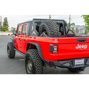 Red Jeep Gladiator with Black Wheels and Tires - DV8 Offroad Chase Rack