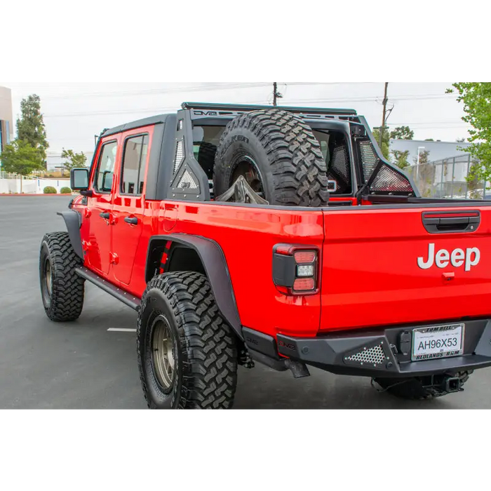 Red Jeep Gladiator with Black Wheels and Tires - DV8 Offroad Chase Rack