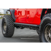 Red Jeep Gladiator with black tire cover - DV8 Offroad 2019+ Side Step/Sliders anti slip panels.