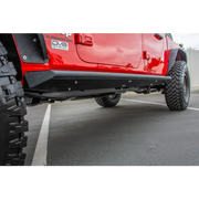 Red Jeep Gladiator with DV8 Offroad Side Step/Sliders, black anti-slip panels.