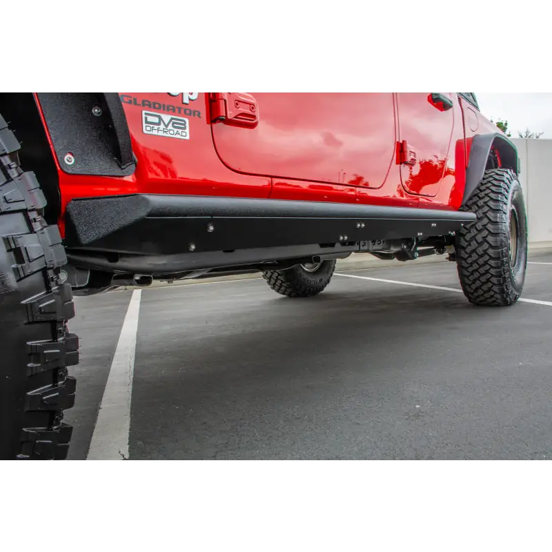 Red Jeep Gladiator with DV8 Offroad Side Step/Sliders, black anti-slip panels.