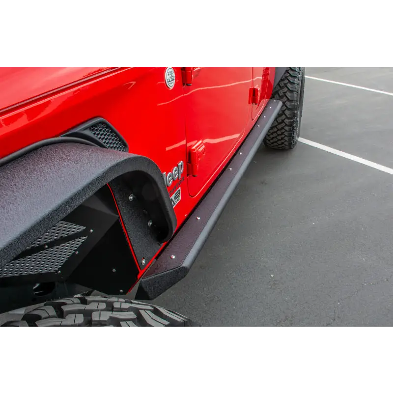 Red Jeep Gladiator with DV8 Offroad side step sliders featuring anti-slip panels.