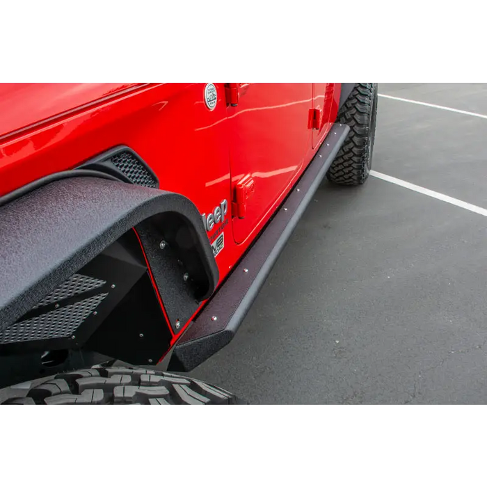 Red Jeep Gladiator with DV8 Offroad side step sliders featuring anti-slip panels.