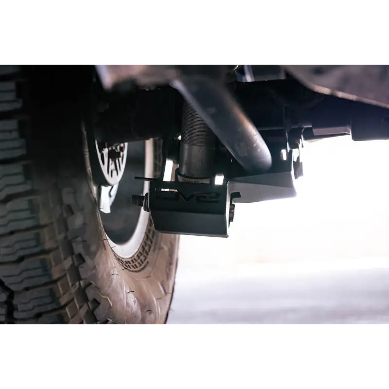 DV8 Offroad Ford Bronco rear shock guard skid plate close up.