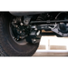 Close up of vehicle tire and wren on DV8 Offroad 2021-2022 Ford Bronco Rear Shock Guard Skid Plates.