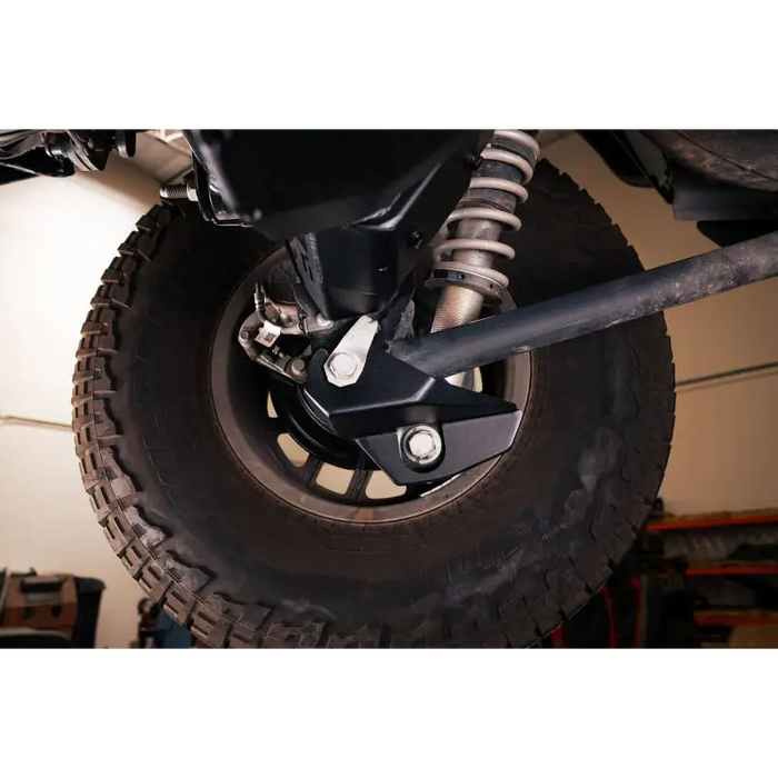 DV8 Offroad 2021-2022 Ford Bronco Rear Shock Guard Skid Plates: Front wheel mounted on rear axle.