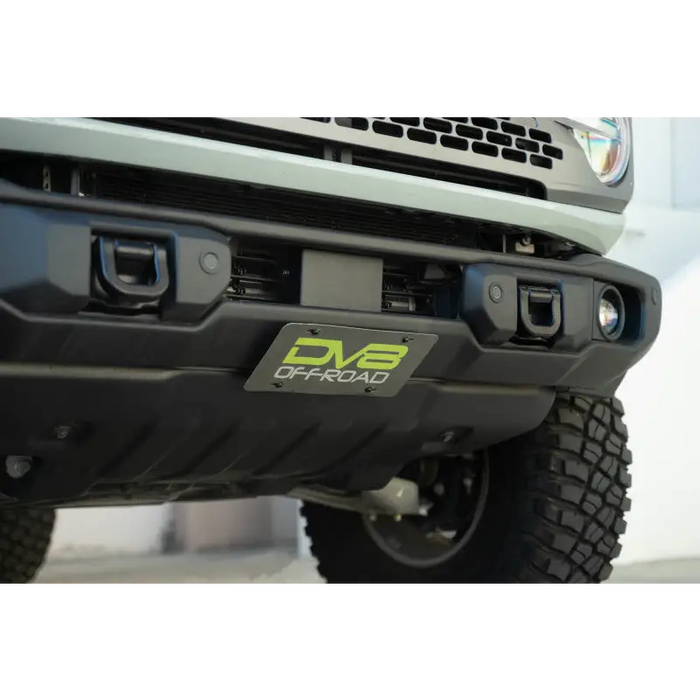 Close up of front bumper cover on Ford F350 with slanted license plate mount.