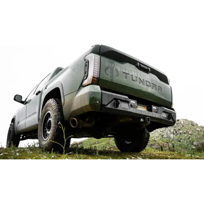 DV8 Offroad 2022-2023 Toyota Tundra MTO Series Rear Bumper on truck parked hill with white sky background