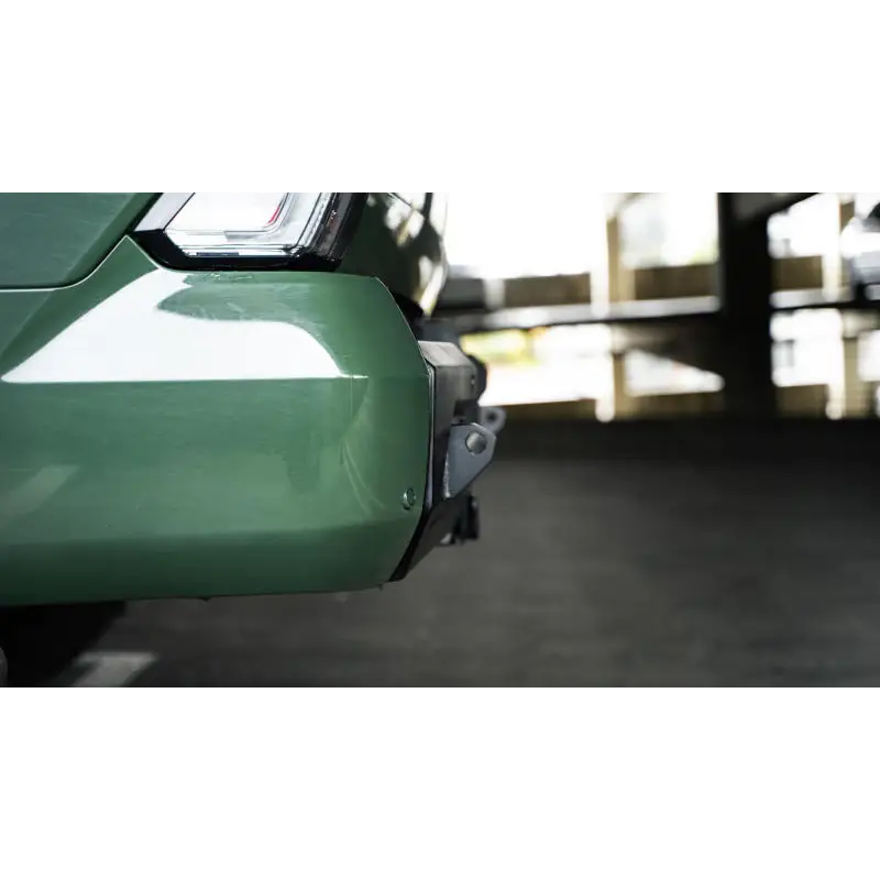 Green car with white tail light on DV8 Offroad 2022-2023 Toyota Tundra MTO Series Rear Bumper