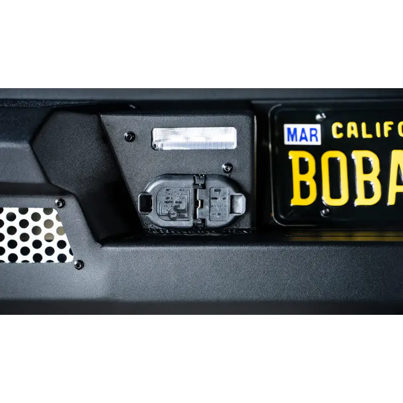 Black and yellow license plate on DV8 Offroad MTO Series rear bumper