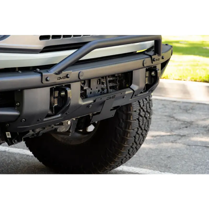 Silver Jeep Wrangler rear bumper bar with license plate relocation bracket.