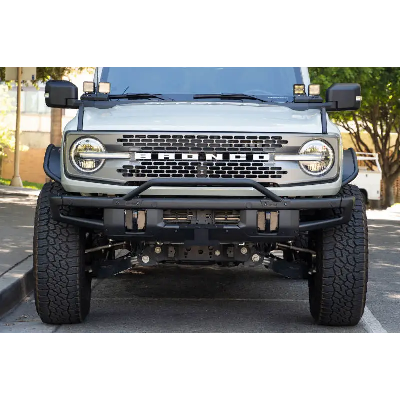 White Jeep with Black Bumper and License Plate Relocation Bracket