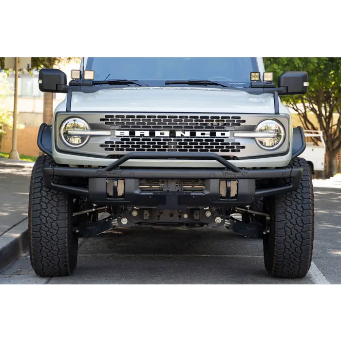 White Jeep with Black Bumper and License Plate Relocation Bracket