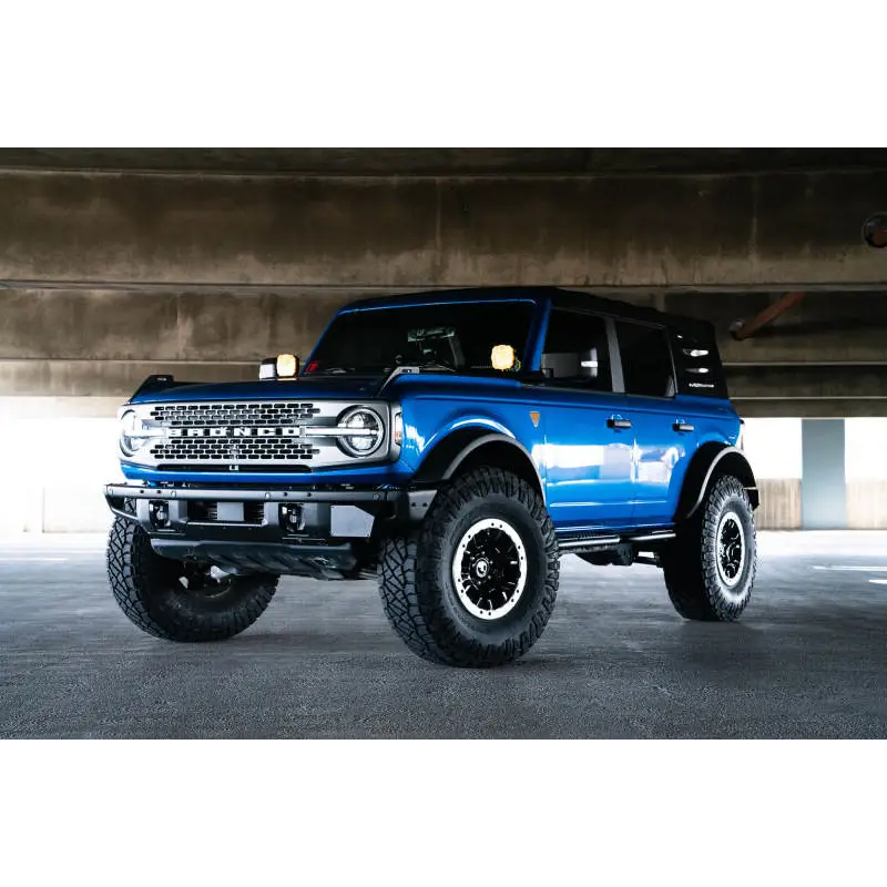 DV8 Offroad license plate relocation bracket for Ford Bronco under bridge parking garage.