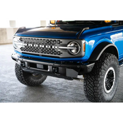 Blue lifted truck with black bumper featuring DV8 Offroad 21-22 Ford Bronco Factory Front Bumper License Relocation Bracket.