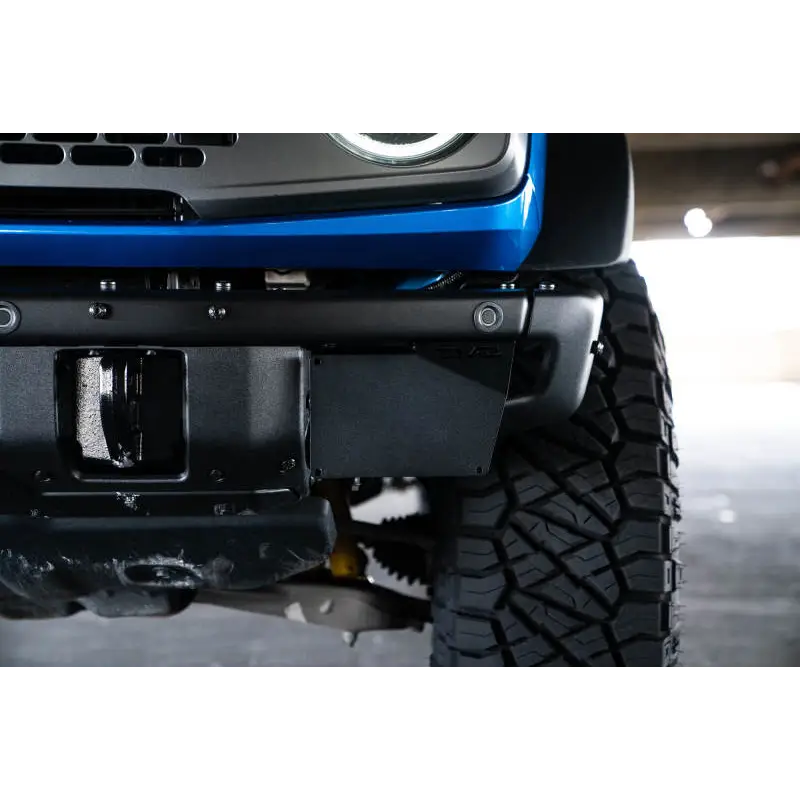 Close up of Jeep front bumper mount with license plate relocation bracket.