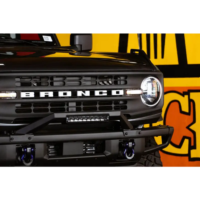 DV8 Offroad Ford Bronco bull bar grille and logo close up.