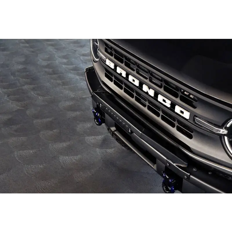Black truck with chrome grille, DV8 Offroad Ford Bronco Bull Bar.