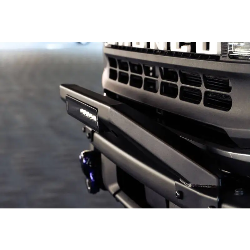 Close up of keyboard and mouse on desk with DV8 Offroad 21-22 Ford Bronco Factory Modular Front Bumper Bull Bar.