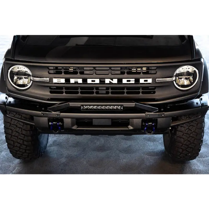 DV8 Offroad black front bumper with light bar for Ford Bronco, featuring bull bar.