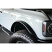 White truck with black bumper parked next to DV8 Offroad 21-22 Ford Bronco Front Inner Fender Liners