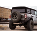 Black Jeep parked on road next to DV8 Offroad 21-22 Ford Bronco FS-15 Series Rear Bumper, made with 5mm steel.