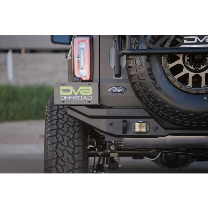 Close-up of DV8 Offroad 21-22 Ford Bronco FS-15 Series Rear Bumper featuring 5mm steel construction and installation instructions.