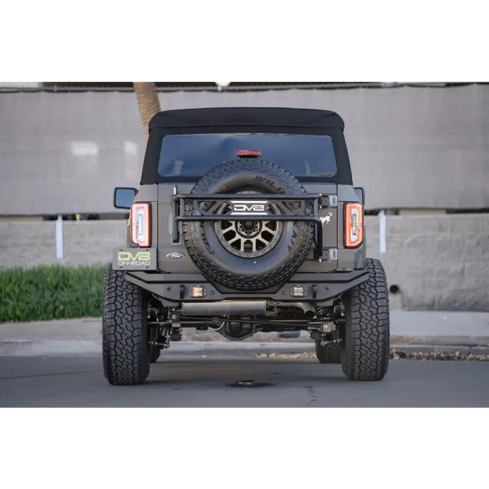 Close-up of Jeep parked on street near building, DV8 Offroad 21-22 Ford Bronco FS-15 Series rear bumper.