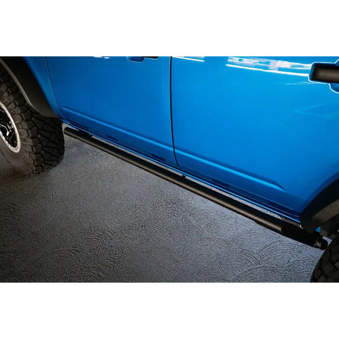 Blue truck with black side step bars - DV8 Offroad 21-22 Ford Bronco FS-15 Series Rock Sliders.