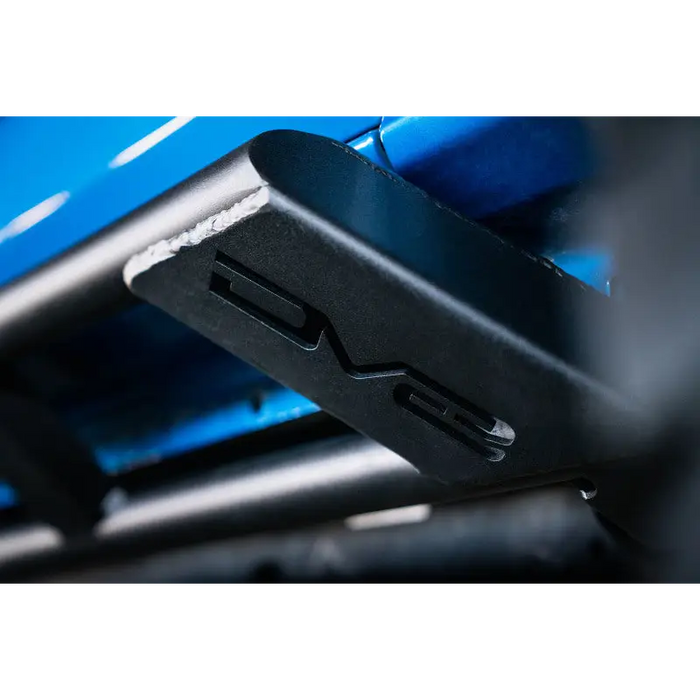 DV8 Offroad Ford Bronco FS-15 Series Rock Sliders on blue machine side