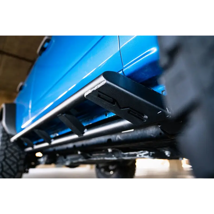 Blue truck with black bumper parked on DV8 Offroad 21-22 Ford Bronco FS-15 Series Rock Sliders