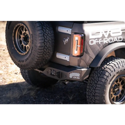 Close up of truck with large tire on DV8 Offroad 21-22 Ford Bronco MTO Series Rear Bumper