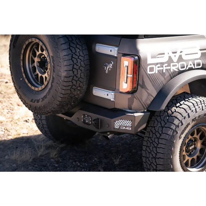 Close up of truck with large tire on DV8 Offroad 21-22 Ford Bronco MTO Series Rear Bumper