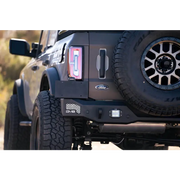 Black Jeep with red license plate on DV8 Offroad 21-22 Ford Bronco MTO Series Rear Bumper.