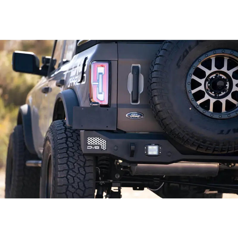 Black Jeep with red license plate on DV8 Offroad 21-22 Ford Bronco MTO Series Rear Bumper.