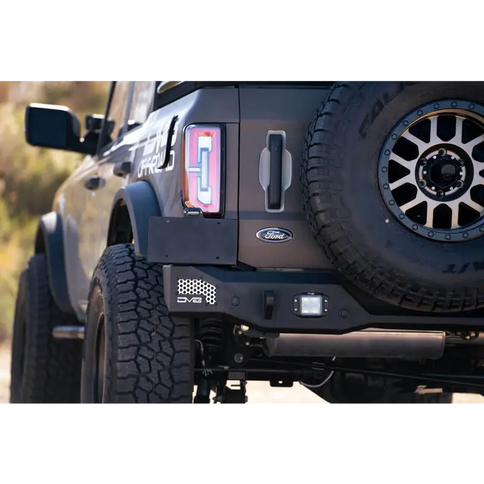 Black Jeep with red license plate on DV8 Offroad 21-22 Ford Bronco MTO Series Rear Bumper.