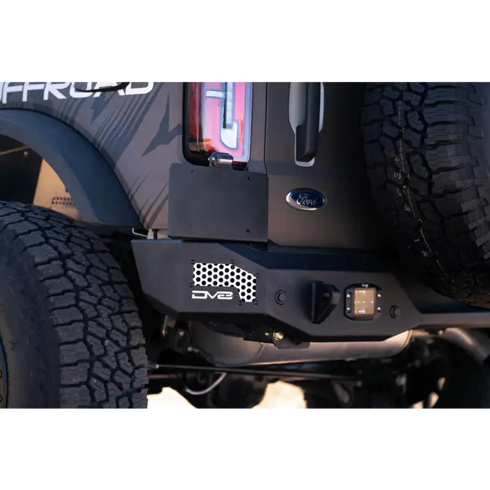Close up view of truck with tire cover, featured in DV8 Offroad 21-22 Ford Bronco MTO Series Rear Bumper.