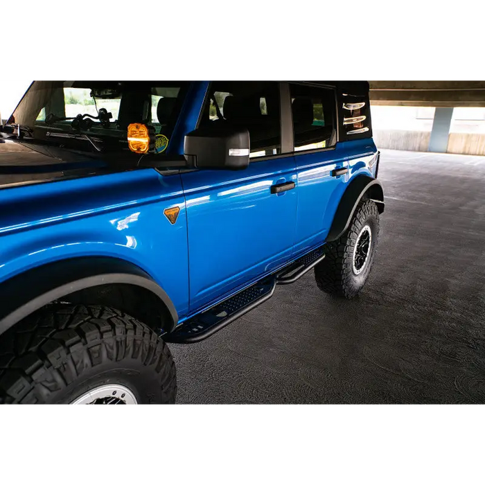 Blue Ford Bronco OE Plus Series Side Steps: DV8 Offroad 21-22.