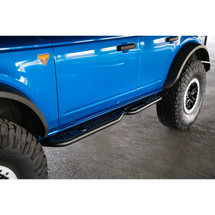 Blue truck with big tire - DV8 Offroad Ford Bronco OE Plus Series Side Steps.