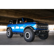 DV8 Offroad Ford Bronco side steps parked under a bridge.