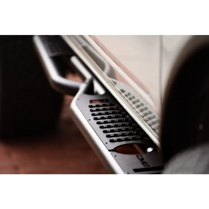 Person playing music on keyboard with DV8 Offroad 21-22 Ford Bronco OE Plus Series Side Steps.
