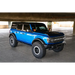 DV8 Offroad Ford Bronco OE Plus Series Side Steps with blue truck parked under a bridge in a parking lot
