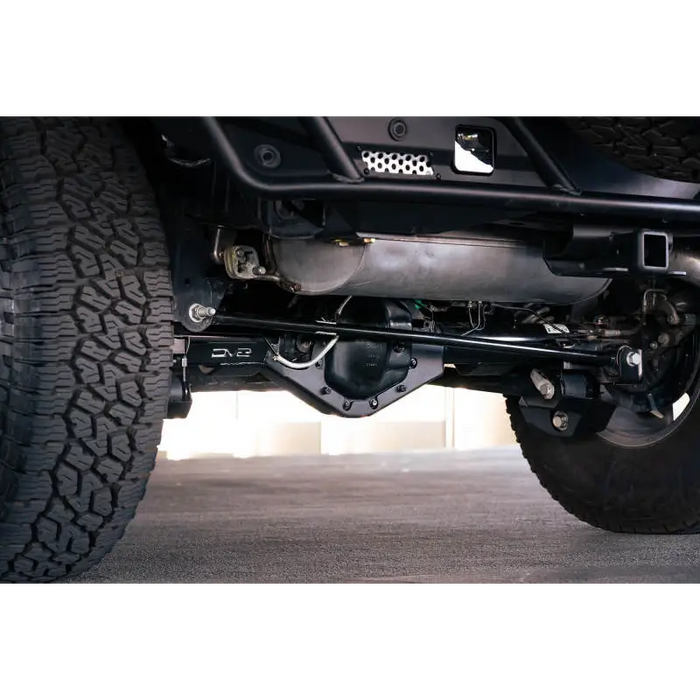 Close up of rear bumper mount on jeep with DV8 Offroad Bronco rear skid plate.