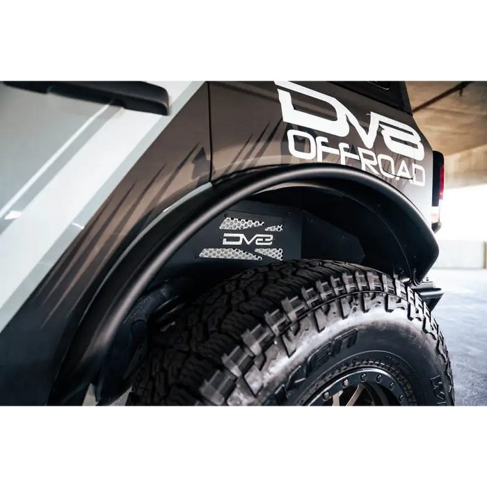 DV8 Offroad Ford Bronco rear inner fender liners with logo on front bumper