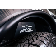 Close up view of vehicle tire on lightweight aluminum weather resistant Ford Bronco rear inner fender liners.