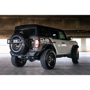 White Ford Bronco rear inner fender liners parked under a bridge